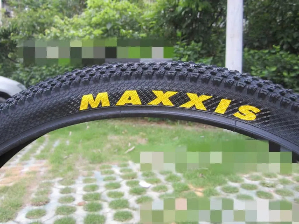 Ultralight mountain bike tyre with reinforced sidewall shown in black, suitable for 26, 27.5 or 29 inch wheels