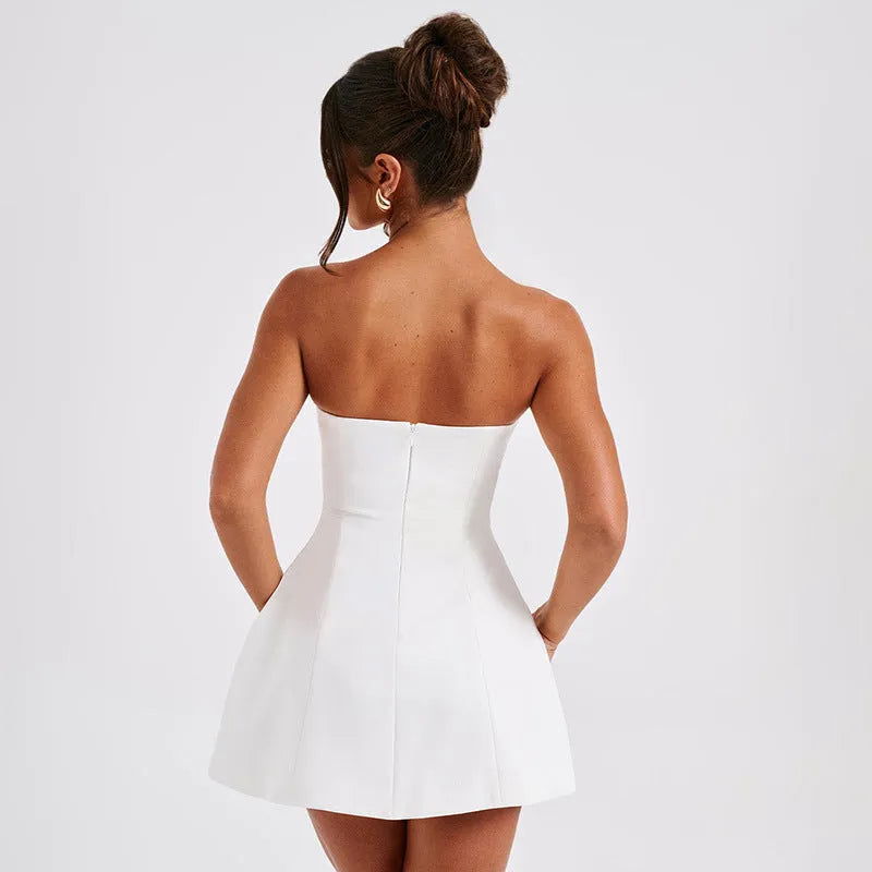 Women's backless solid colour tube dress with high waist and A-line short skirt.