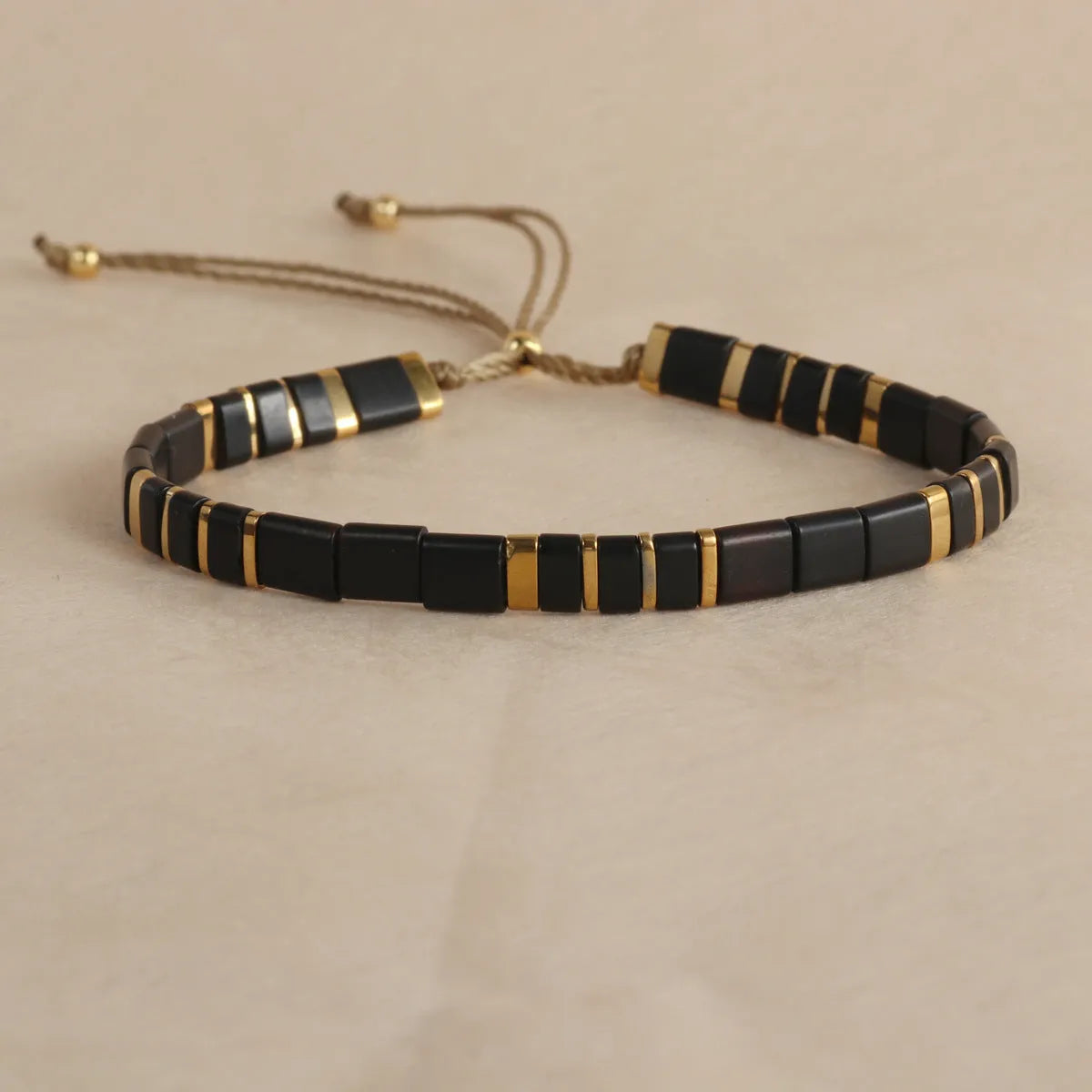 Geometric glass pull bead bracelet in milky white, black, green, blue or red with round decorative elements