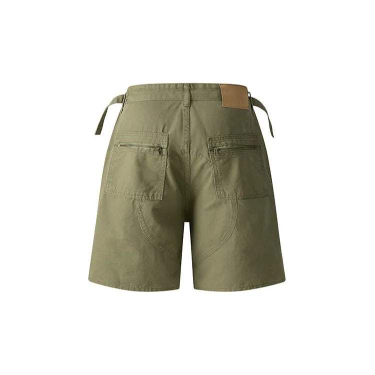 Retro loose-fit workwear shorts in washed cotton fabric with a zipper fly, shown in camouflage colour.