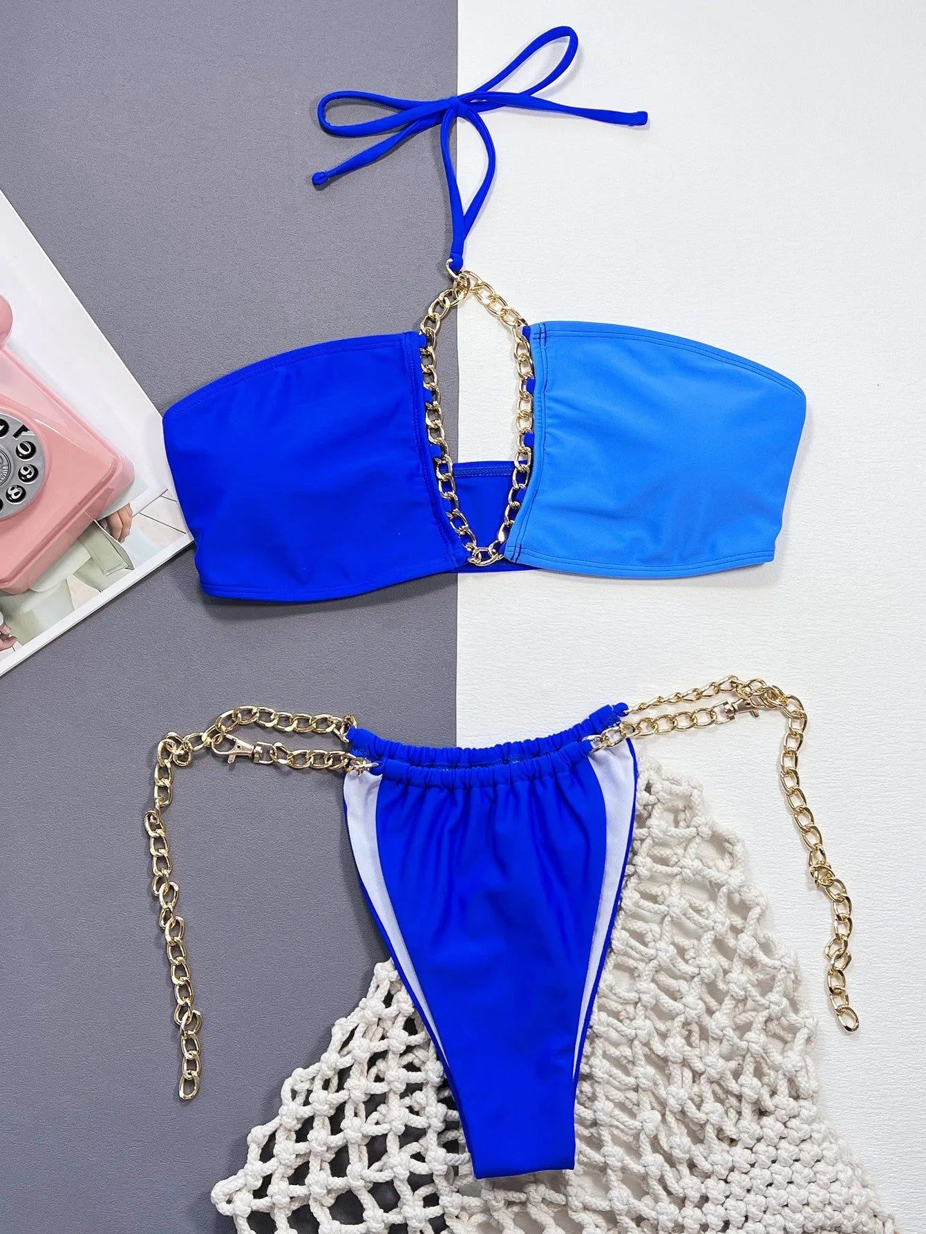 Blue solid colour women's nylon bikini swimsuit set on a white background.