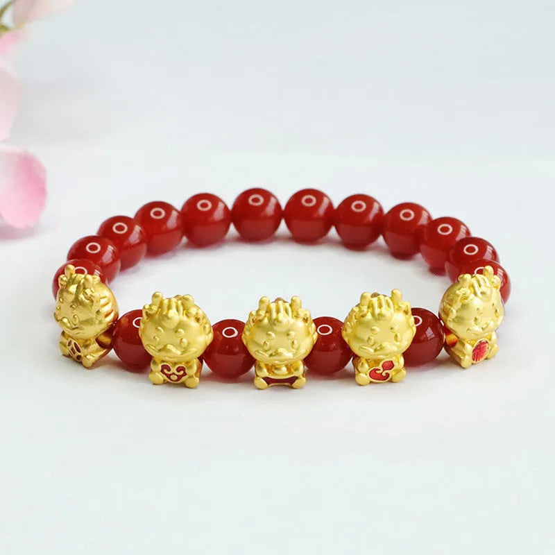 Natural red agate bead bracelet with a detailed five blessings dragon charm on a white background.