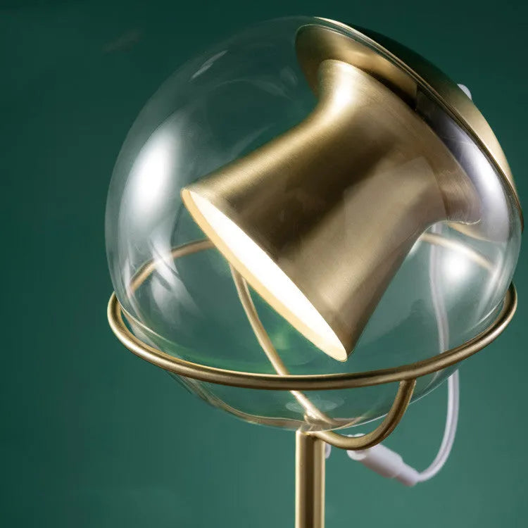 Modern glass desk lamp with a touch-sensitive dimmer base and an LED light source.