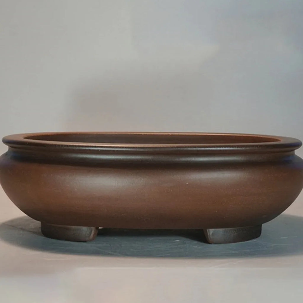 Handmade purple clay classical style flowerpot for indoor desktop use.