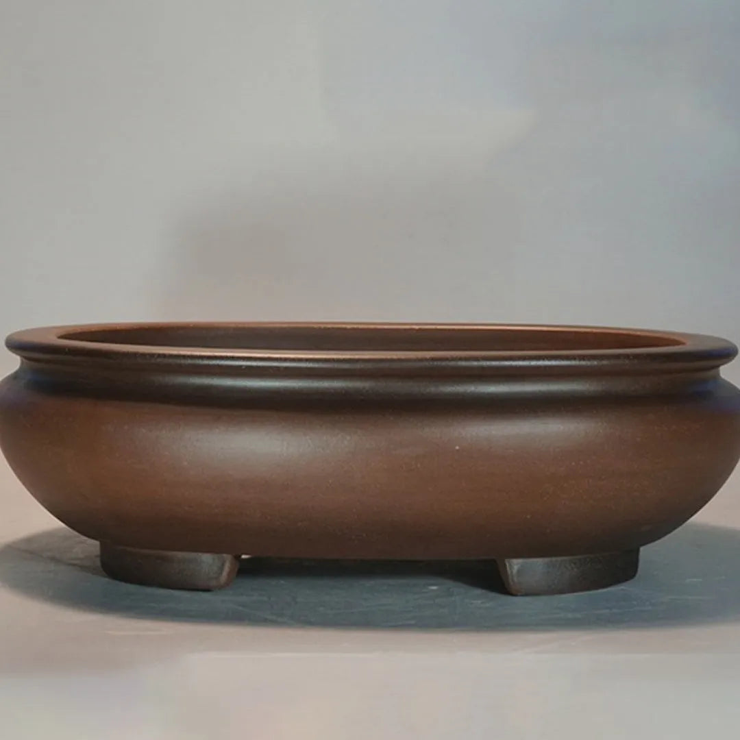 Handmade purple clay classical style flowerpot for indoor desktop use.