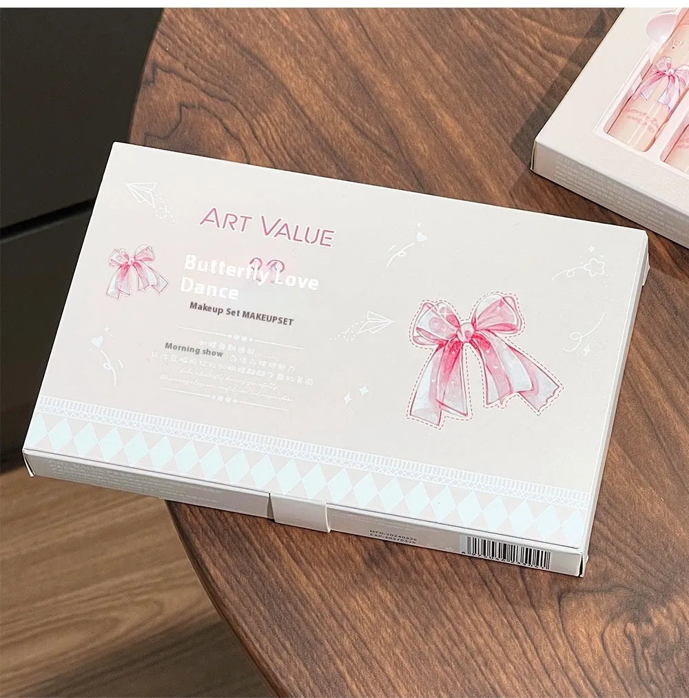 Butterfly Box makeup set showing four lip mud containers, powder blusher, and necklace in pink packaging