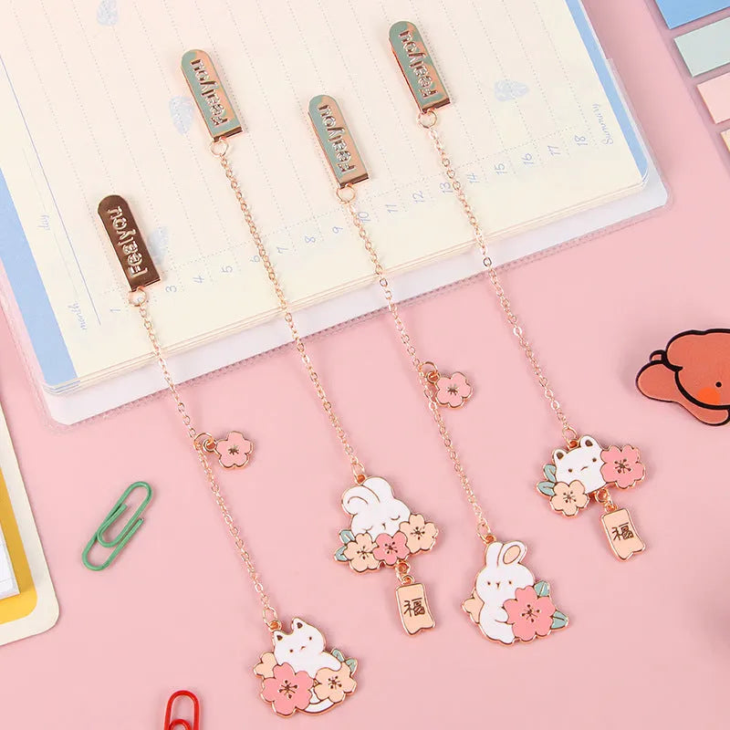 Cute cartoon metal bookmark pendant featuring a cherry cat or sakura rabbit design with sakura blossoms or a fu character.