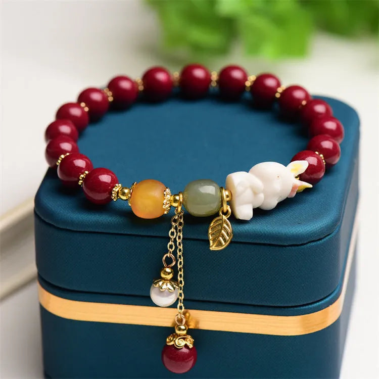 Women's natural beeswax and purple gold sand bracelet with cinnabar rabbit charm