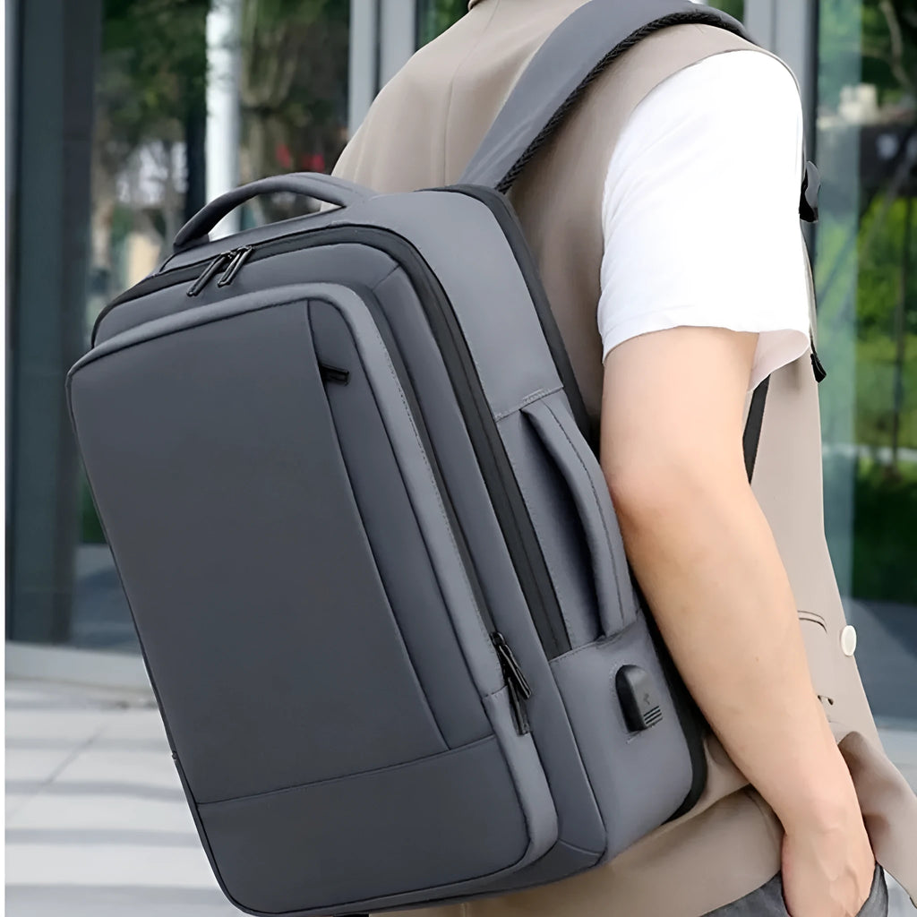 Men's black and grey waterproof Oxford cloth backpack with curved shoulder straps for business and outdoor travel