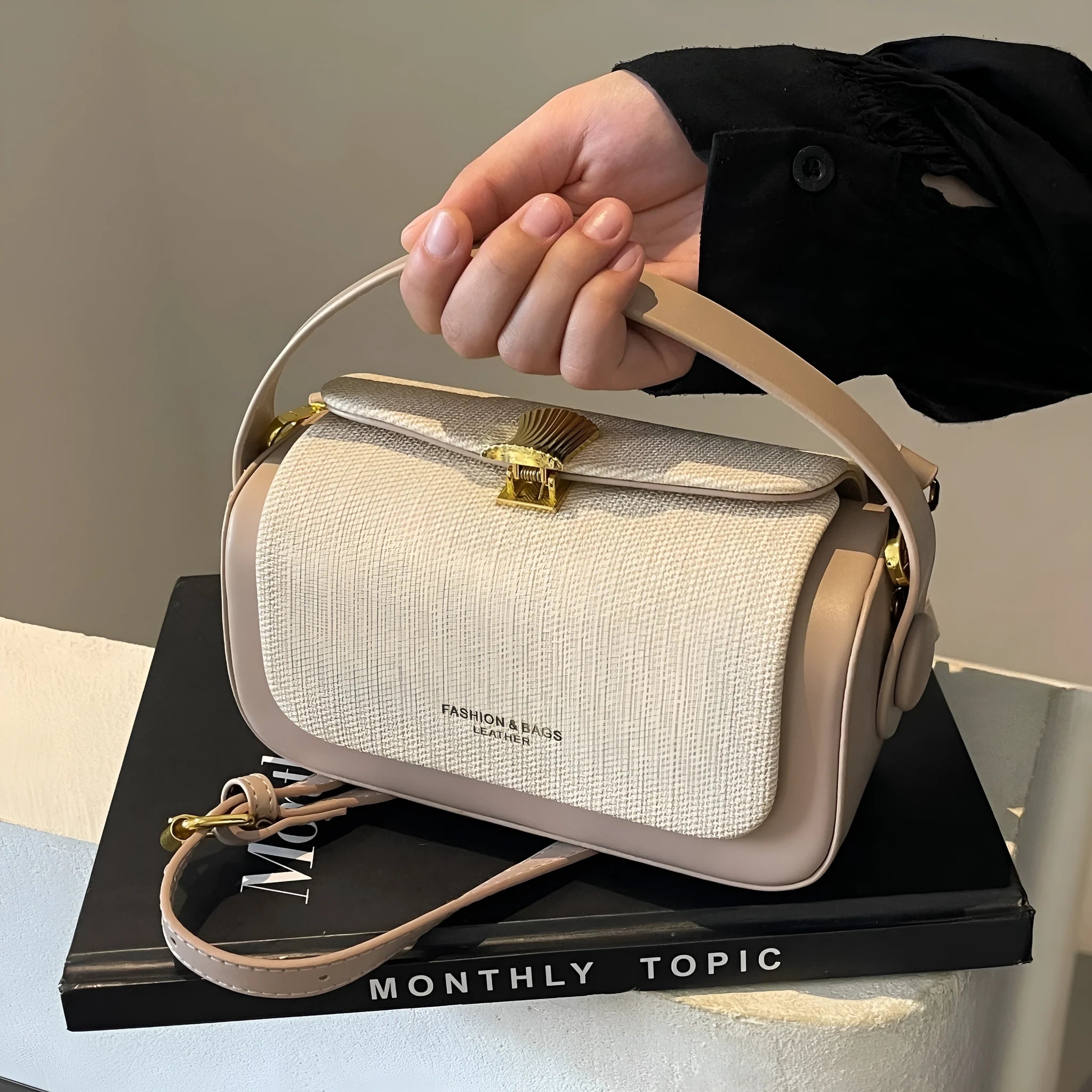 Women's PU leather crossbody messenger bag in a horizontal square shape with a single strap.