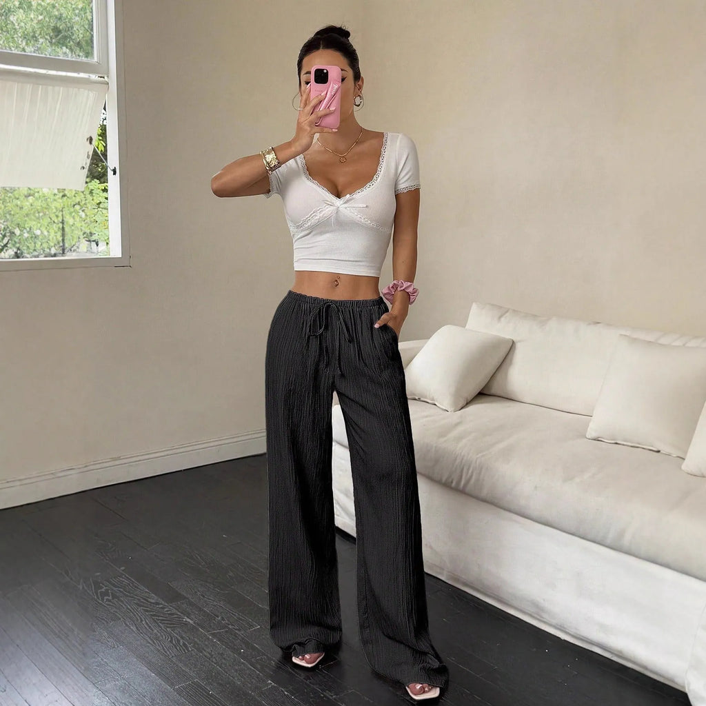 Women's black wide-leg trousers with lace-up waist trimming detail