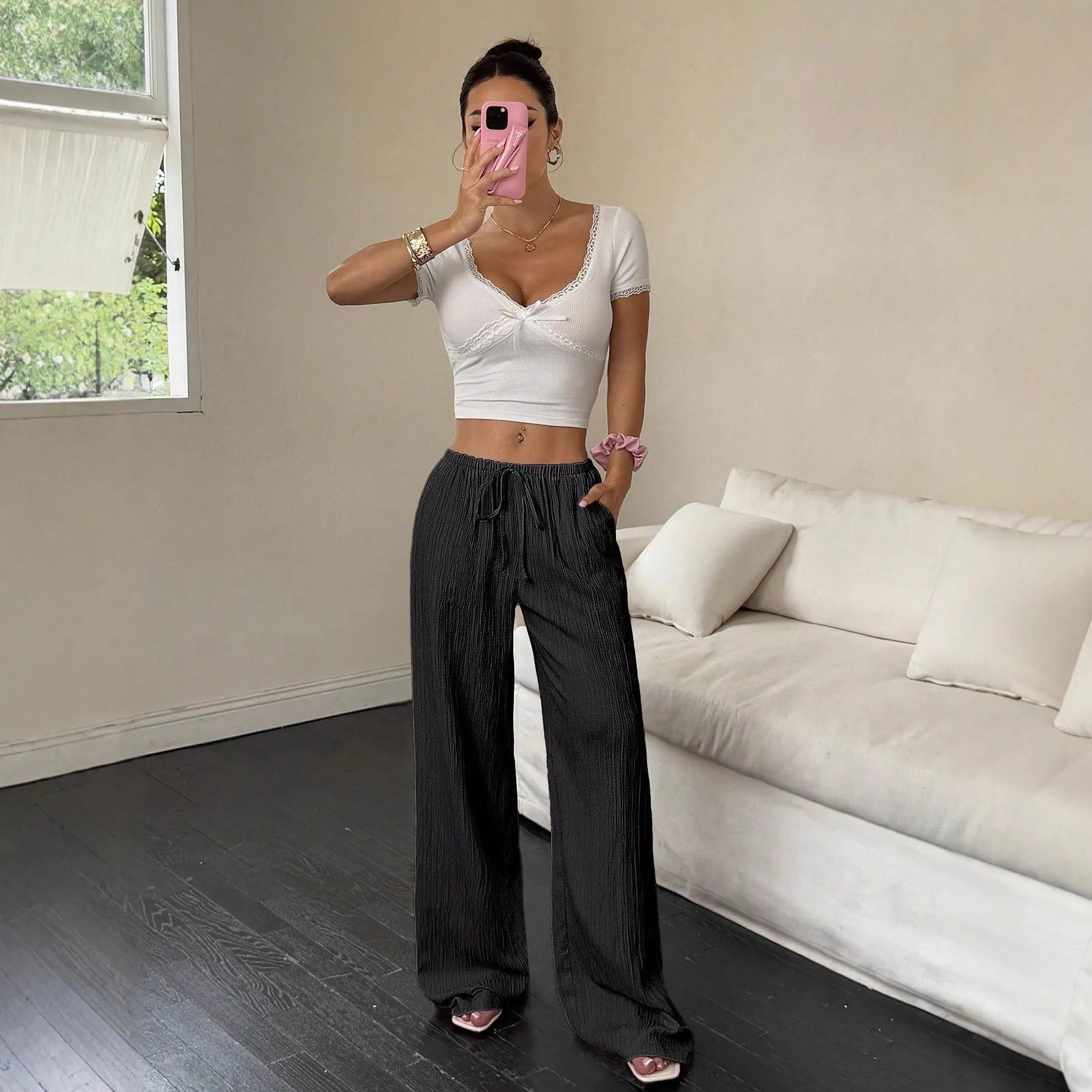 Women's black wide-leg trousers with lace-up waist trimming detail