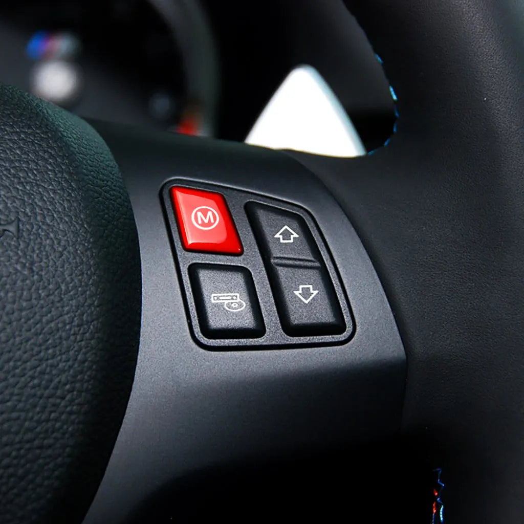 Pair of red M1 and M2 steering wheel mode button accessories for BMW cars