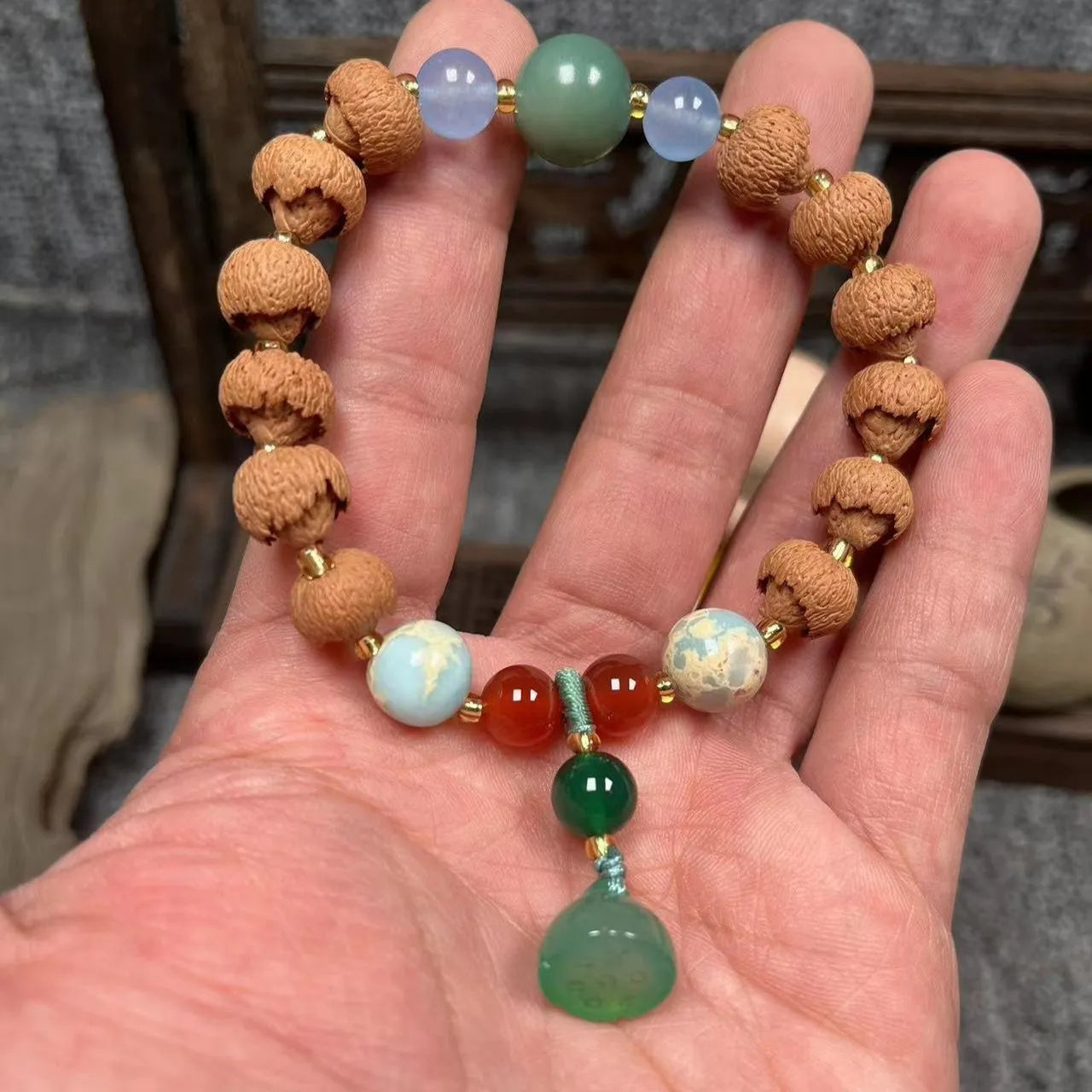 Carved bodhi root pumpkin lotus bracelet with white jade beads and mixed sizing