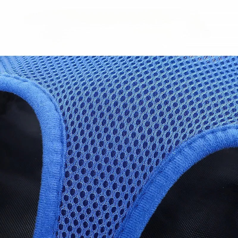 Adjustable nylon dog carrier backpack worn on front, showing mesh panels and open-top design for a small dog.