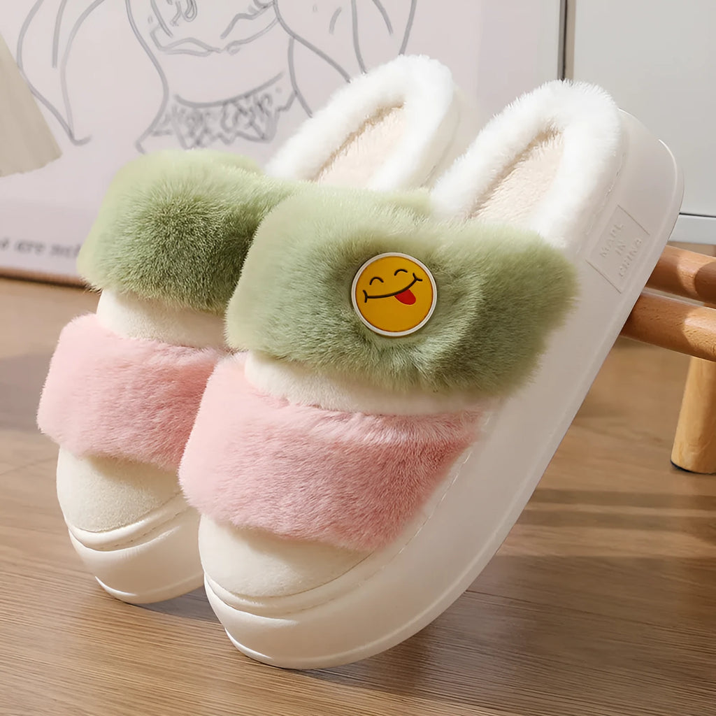 Pink and blue thermal cotton slippers with plush upper and cashmere lining, shown on a foot.