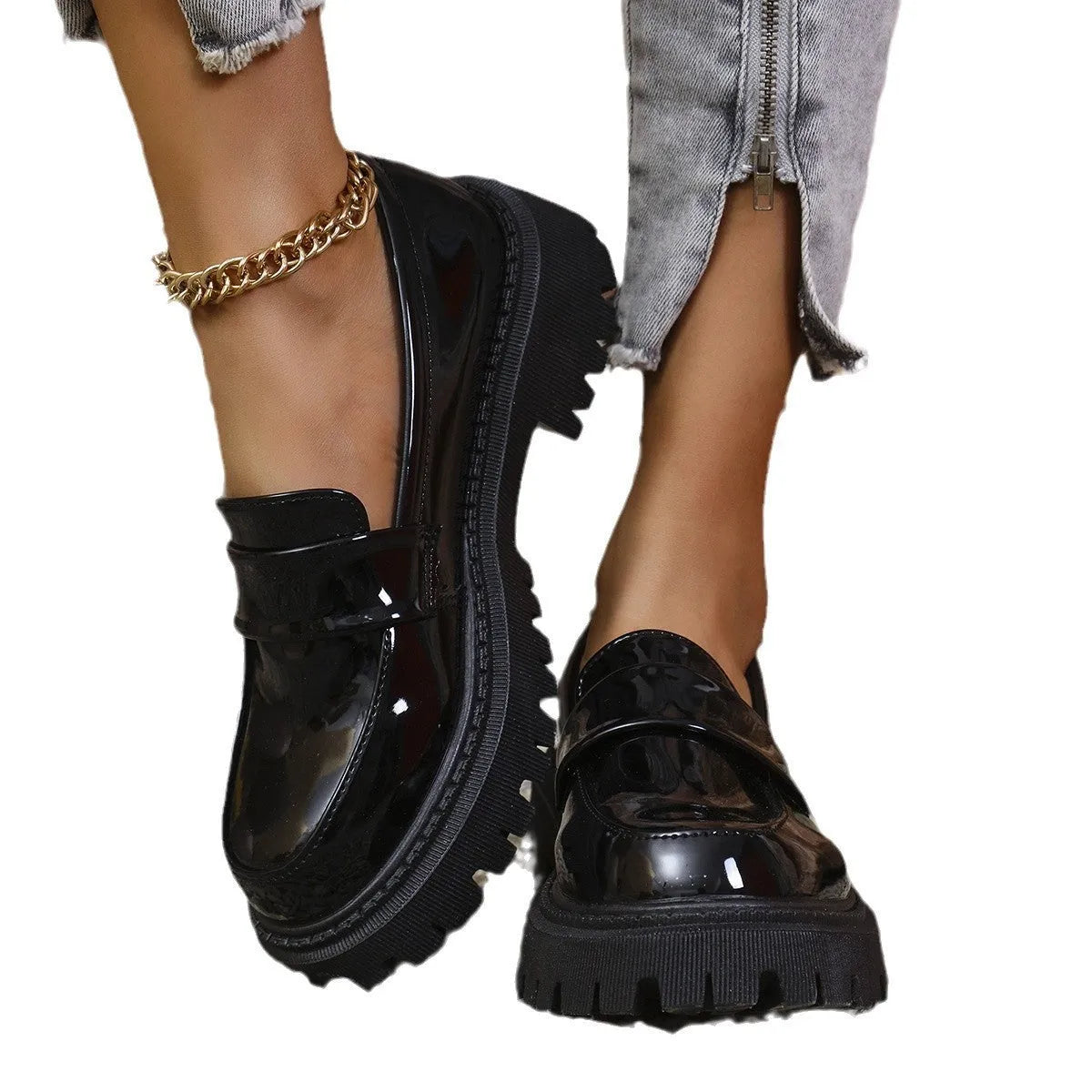 Plus size women's black slip-on loafers with a chunky platform heel and rubber sole.