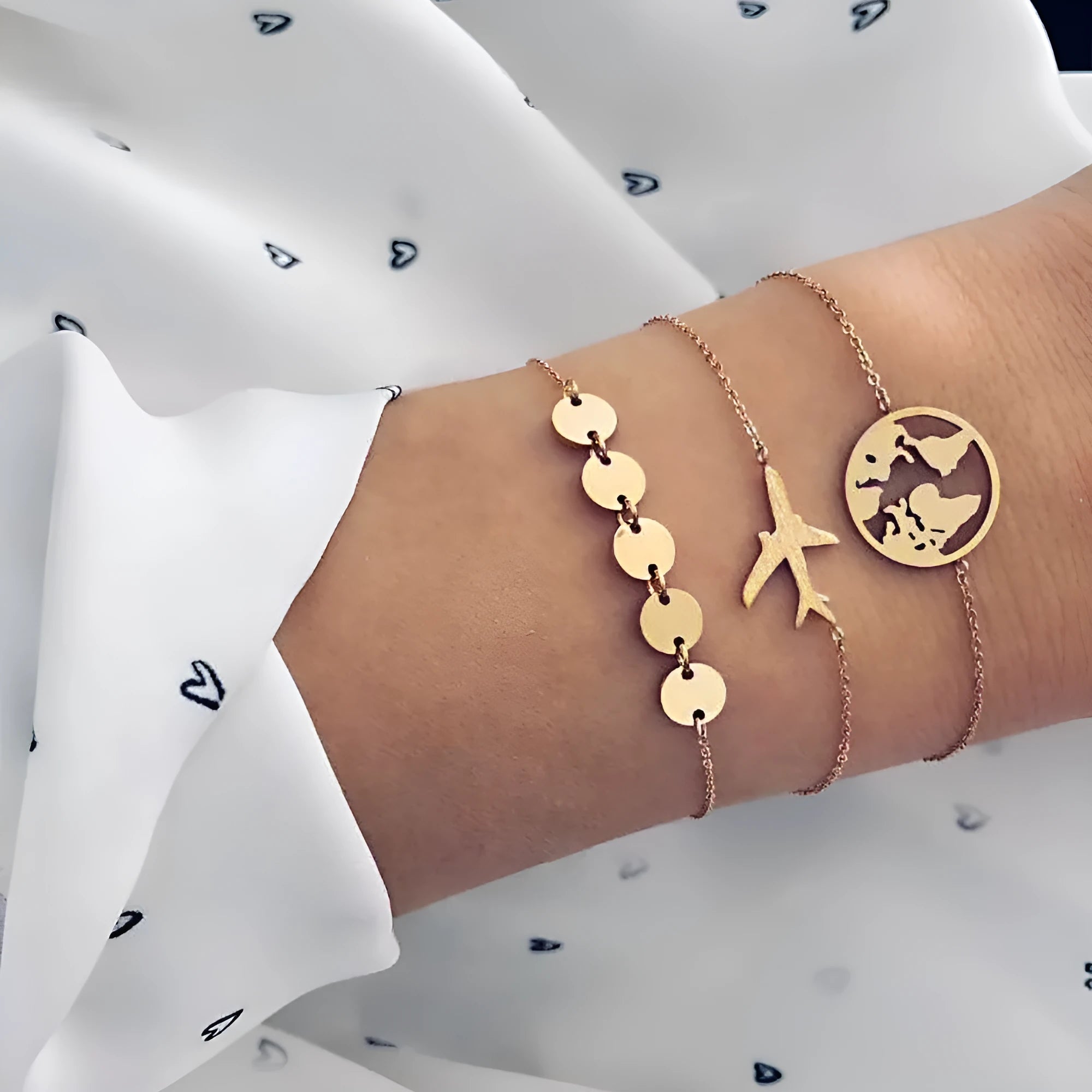Three bohemian bracelets with alloy aircraft map heart charms in electroplated finish