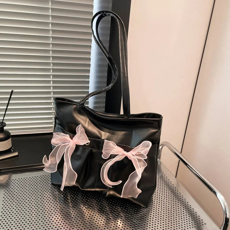 College style bow tote bag in PU leather with double shoulder straps and internal zipper organiser