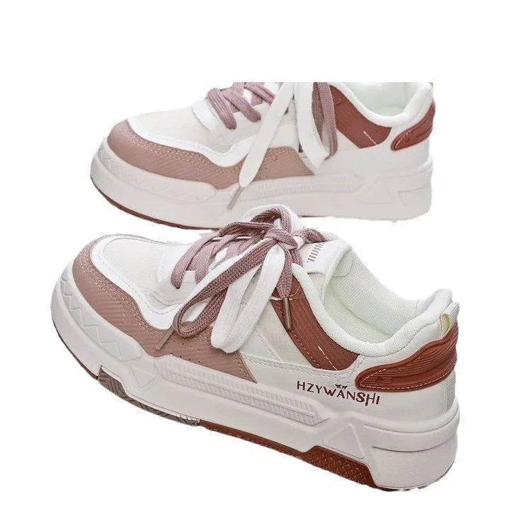 Children's beige lace-up board shoes with thick rubber sole and cross shoulder strap detail.