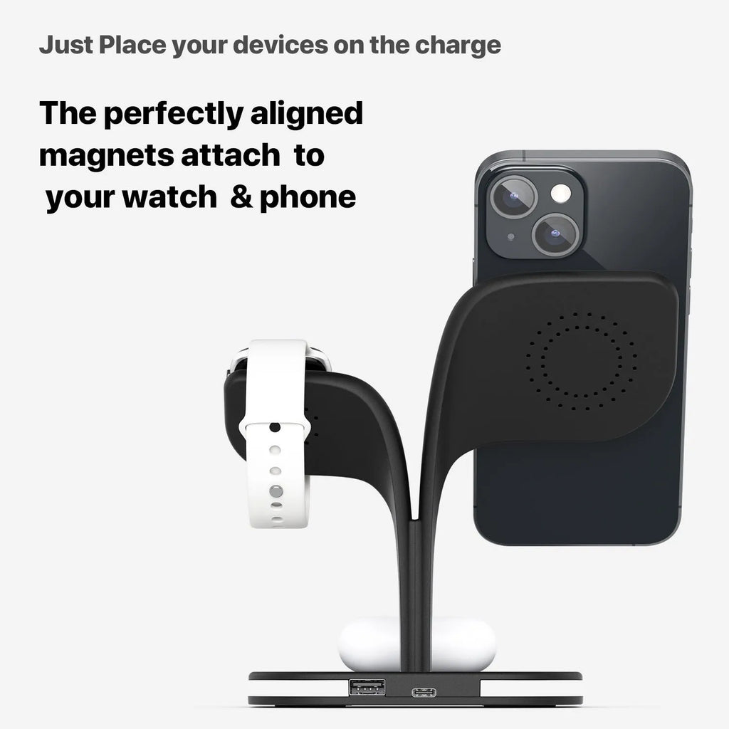 Black and white wireless charging station for phone, watch, and headphones on a desk