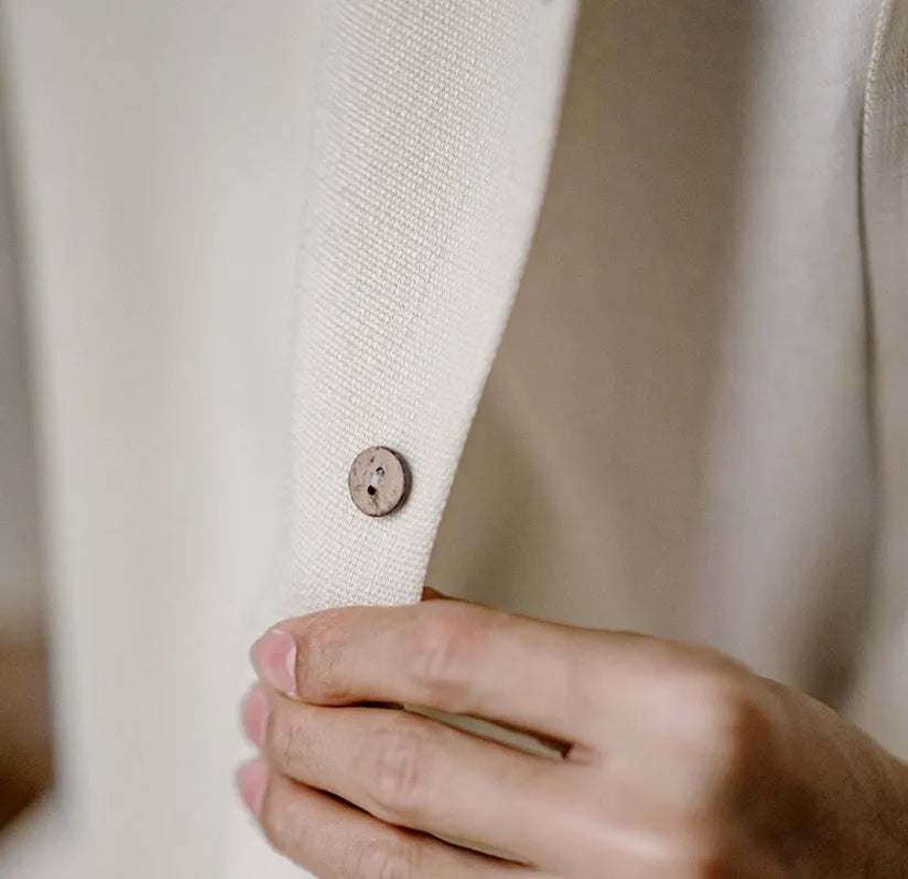 A light apricot men's shirt with a bamboo plant pattern and a relaxed Cuban collar.