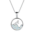 A geometric round opal pendant necklace with a fishtail design on a chain.