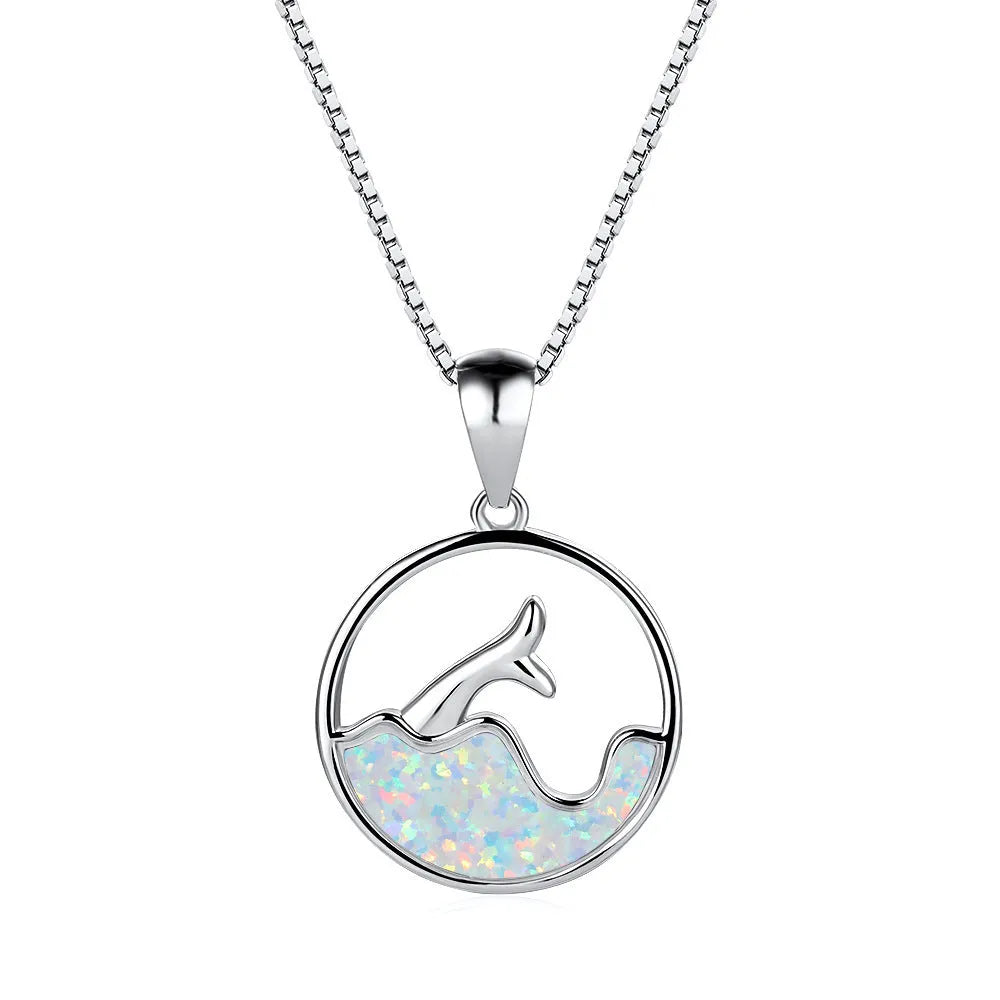 A geometric round opal pendant necklace with a fishtail design on a chain.