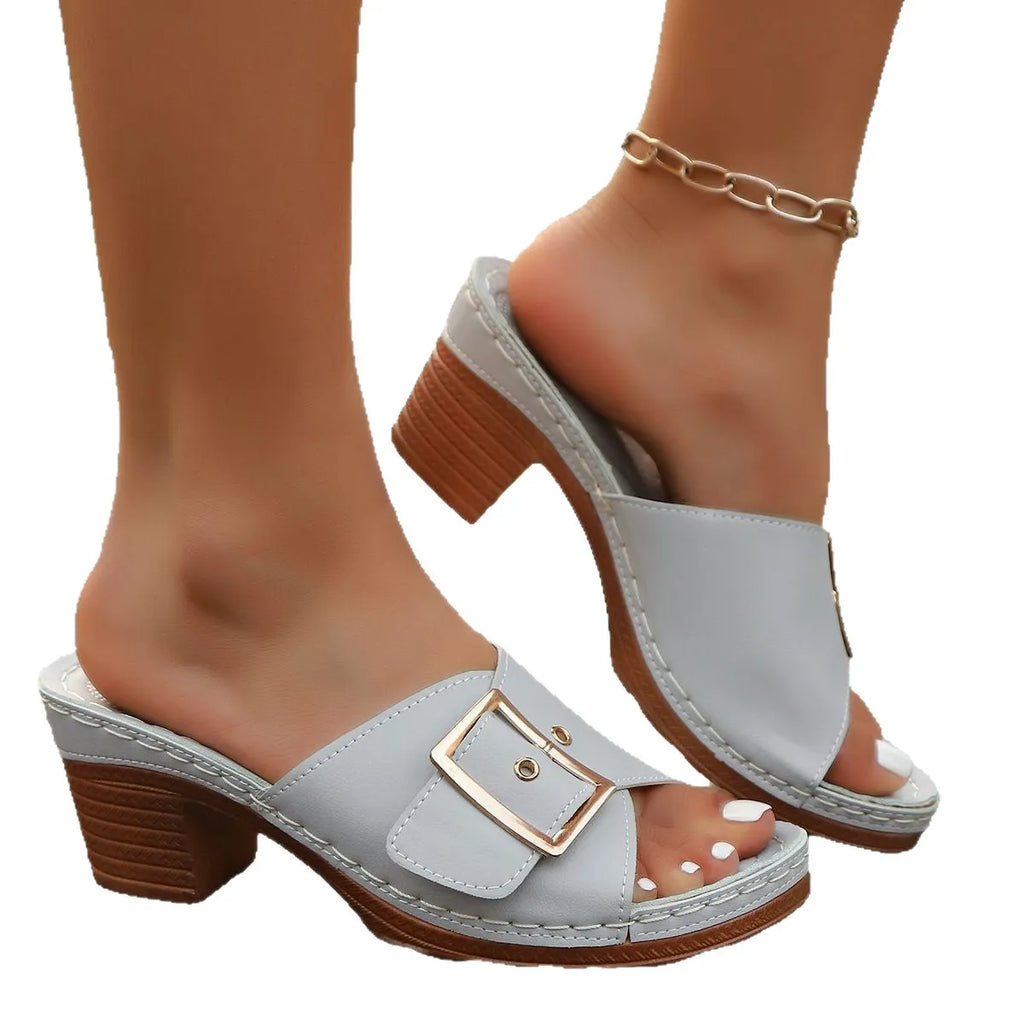 Women's black chunky heel slippers with metal buckle and round toe