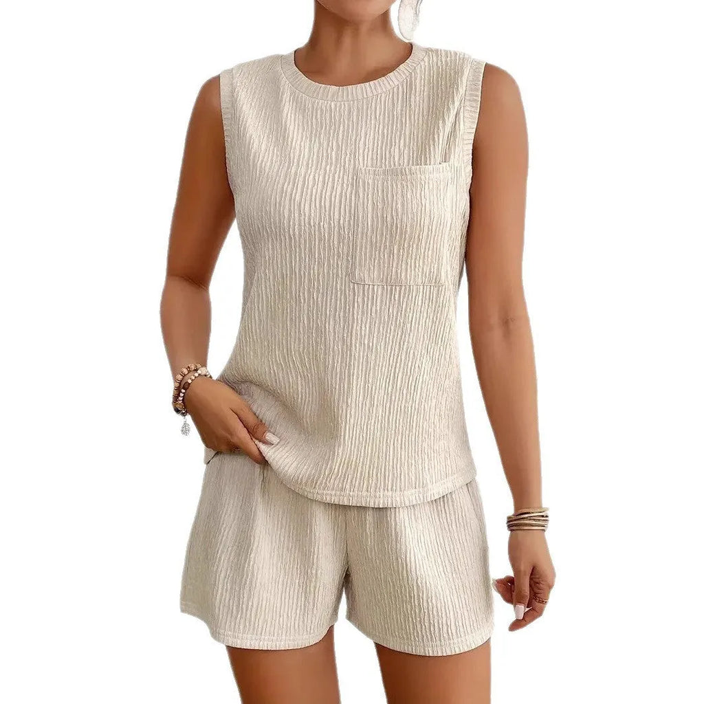 Women's apricot polyester sleeveless vest and matching shorts set laid flat