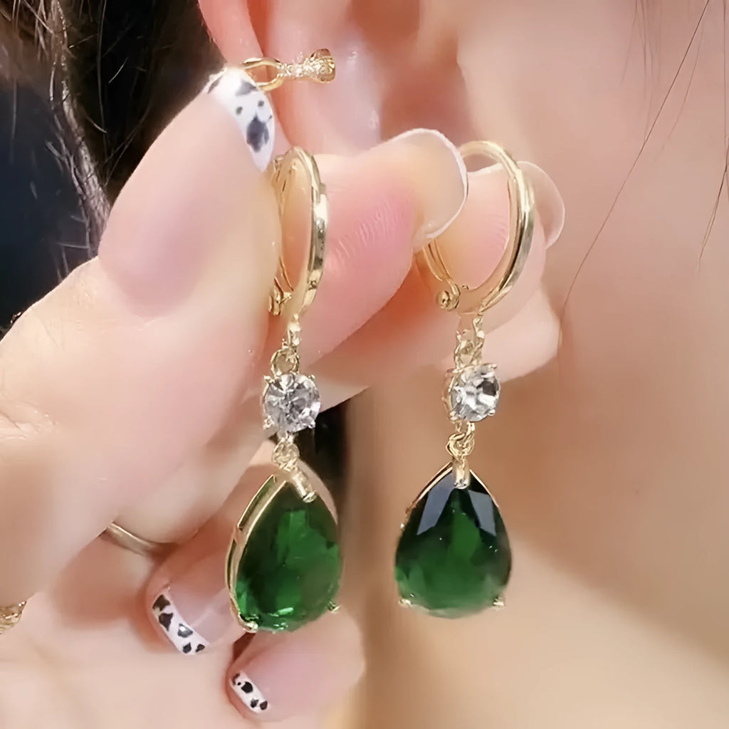 Green geometric teardrop alloy earrings with drop design on display