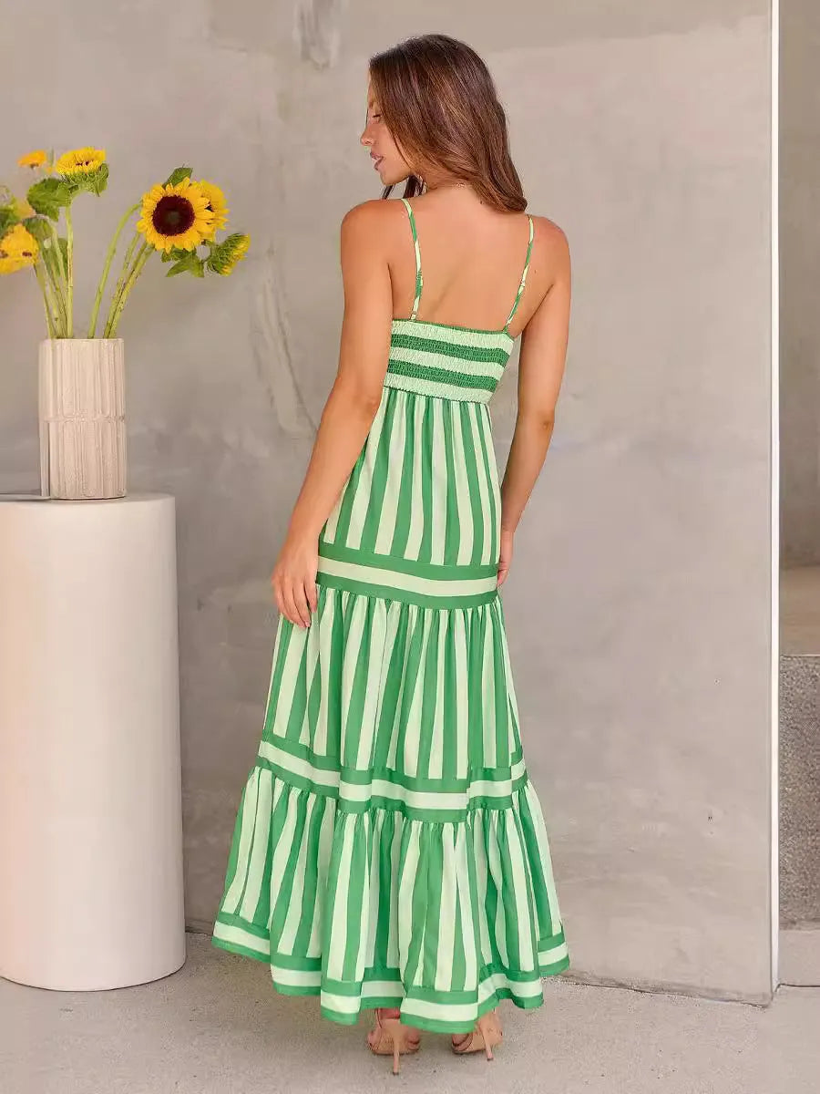 Women's printed long dress with suspender straps, square neckline, side pockets, and backless design
