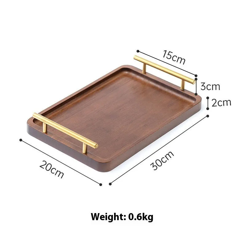 Brown handle square bamboo serving tray on a table.
