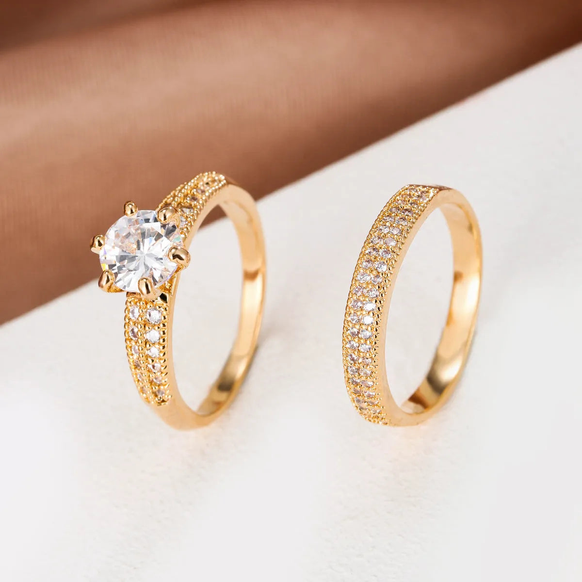 Copper hollow geometric ring with zircon accents in golden-white colour option on finger