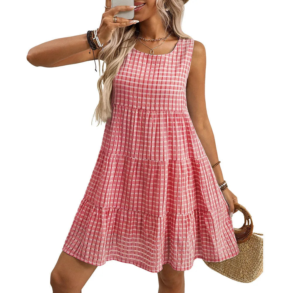 Loose-fitting women's sleeveless plaid dress with a high waist and swing skirt.