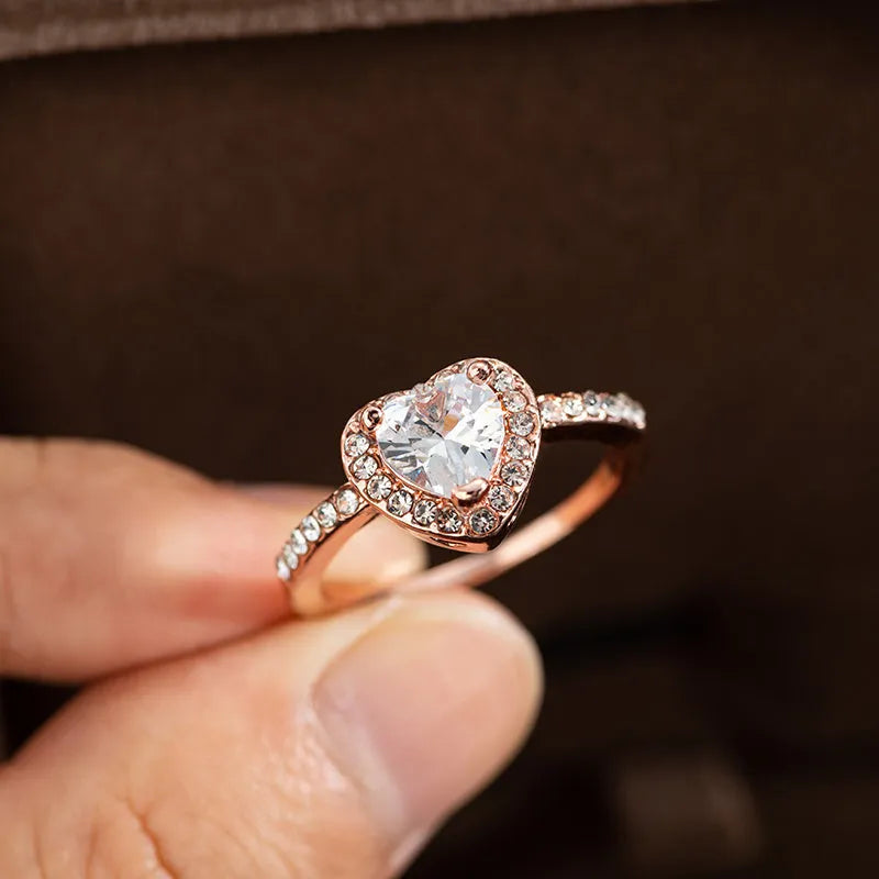 Heart-shaped crystal wedding ring with electroplated rose gold or silver finish on white copper