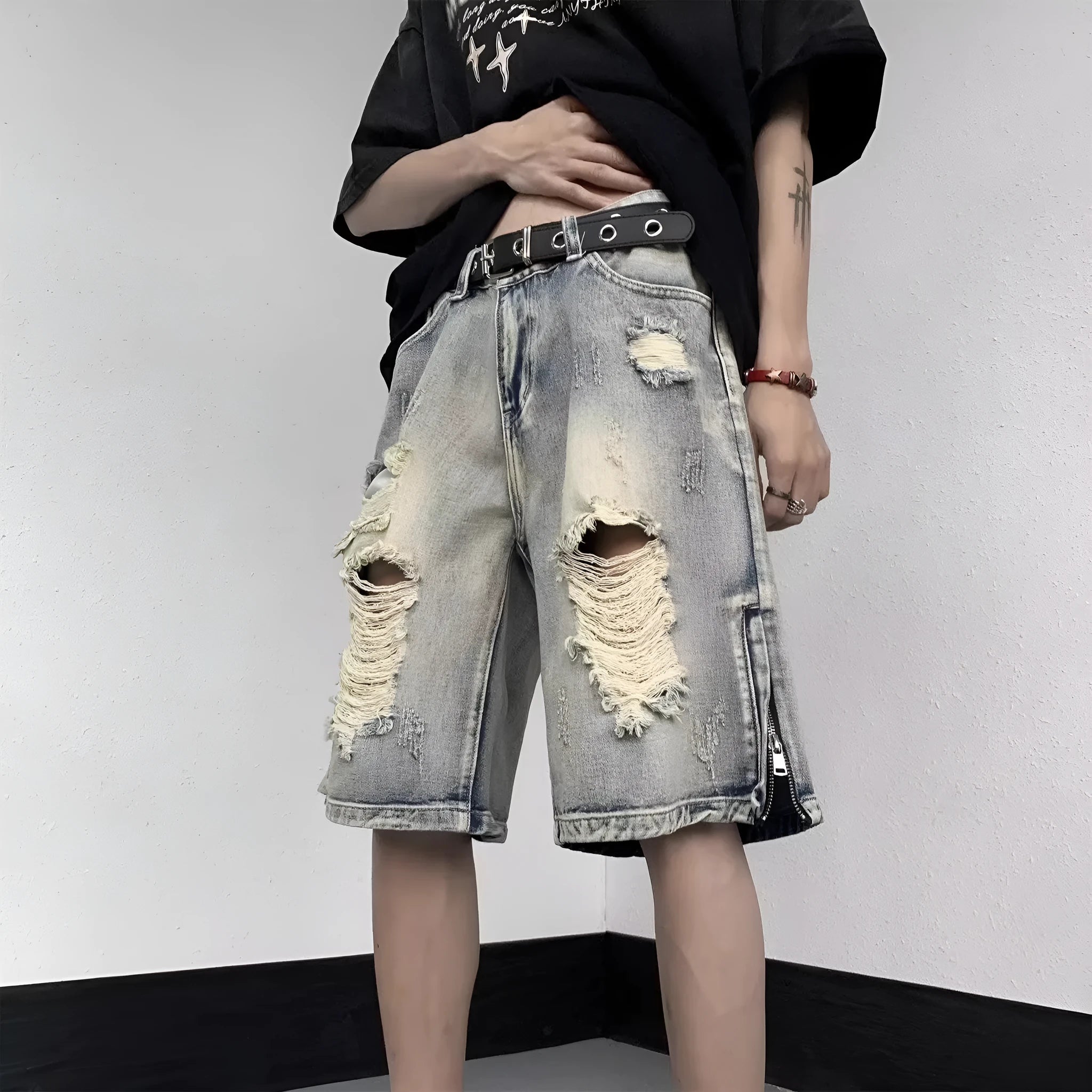 Blue retro-style denim shorts with a wide-leg, loose fit on a person.
