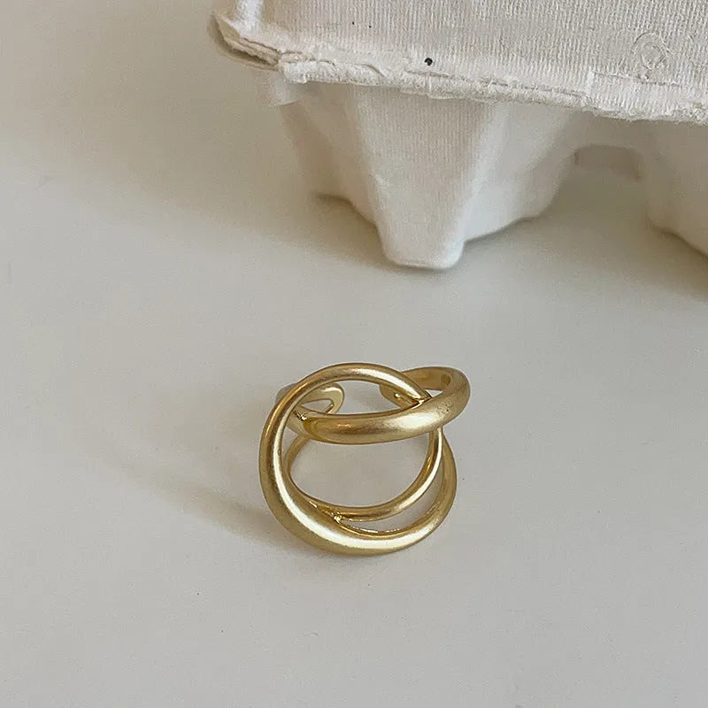 Three-dimensional interlaced geometric open ring with matte metal finish