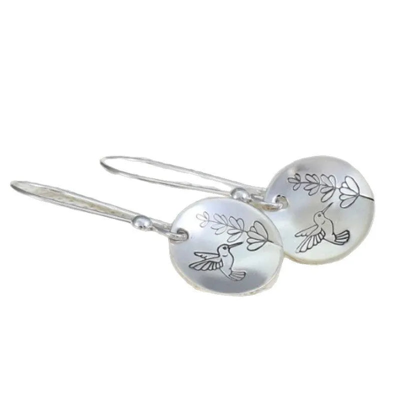 Silver circular earrings with bird and flower motifs in retro design