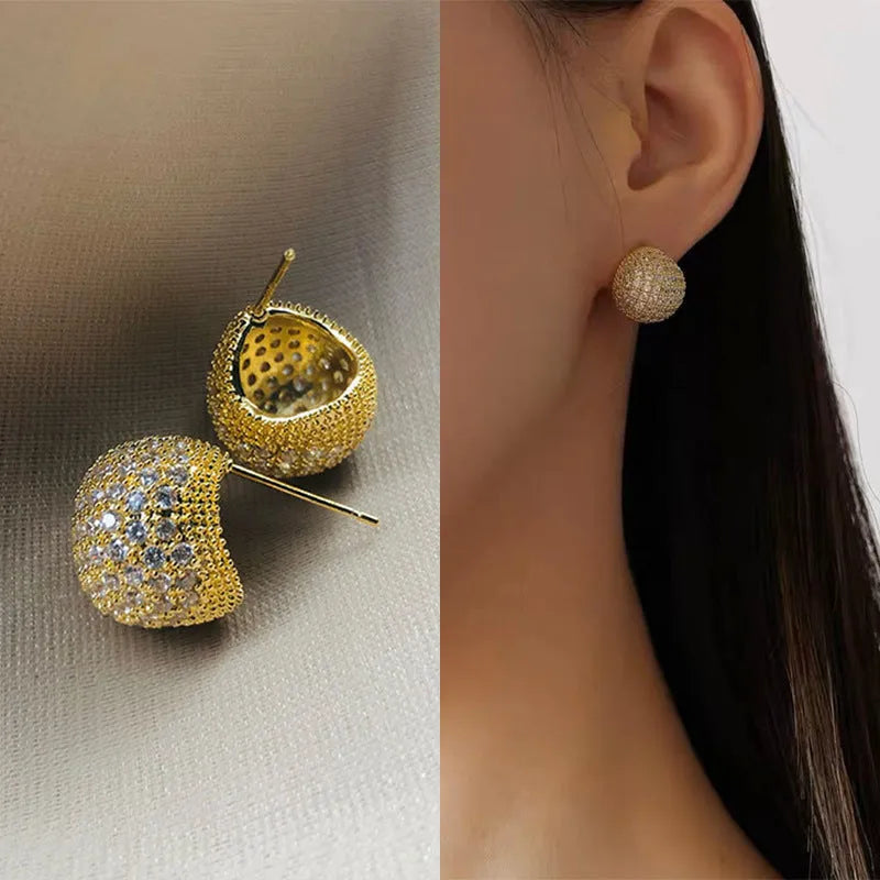 Gold and white geometric drop earrings with little golden beans design and ear clip fastening