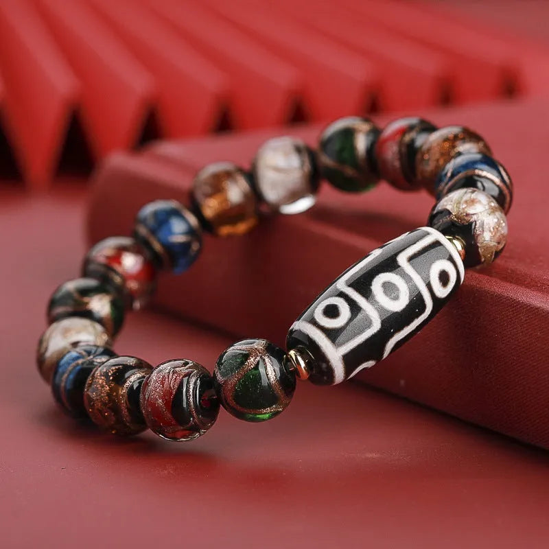 Close-up of a colourful Chinese snake year lucky bead bracelet made from hand-strung coloured glaze.