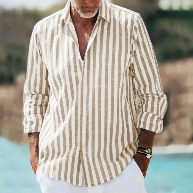 Man wearing a loose-fit short sleeve plaid shirt with a lapel collar, shown in a solid colour.