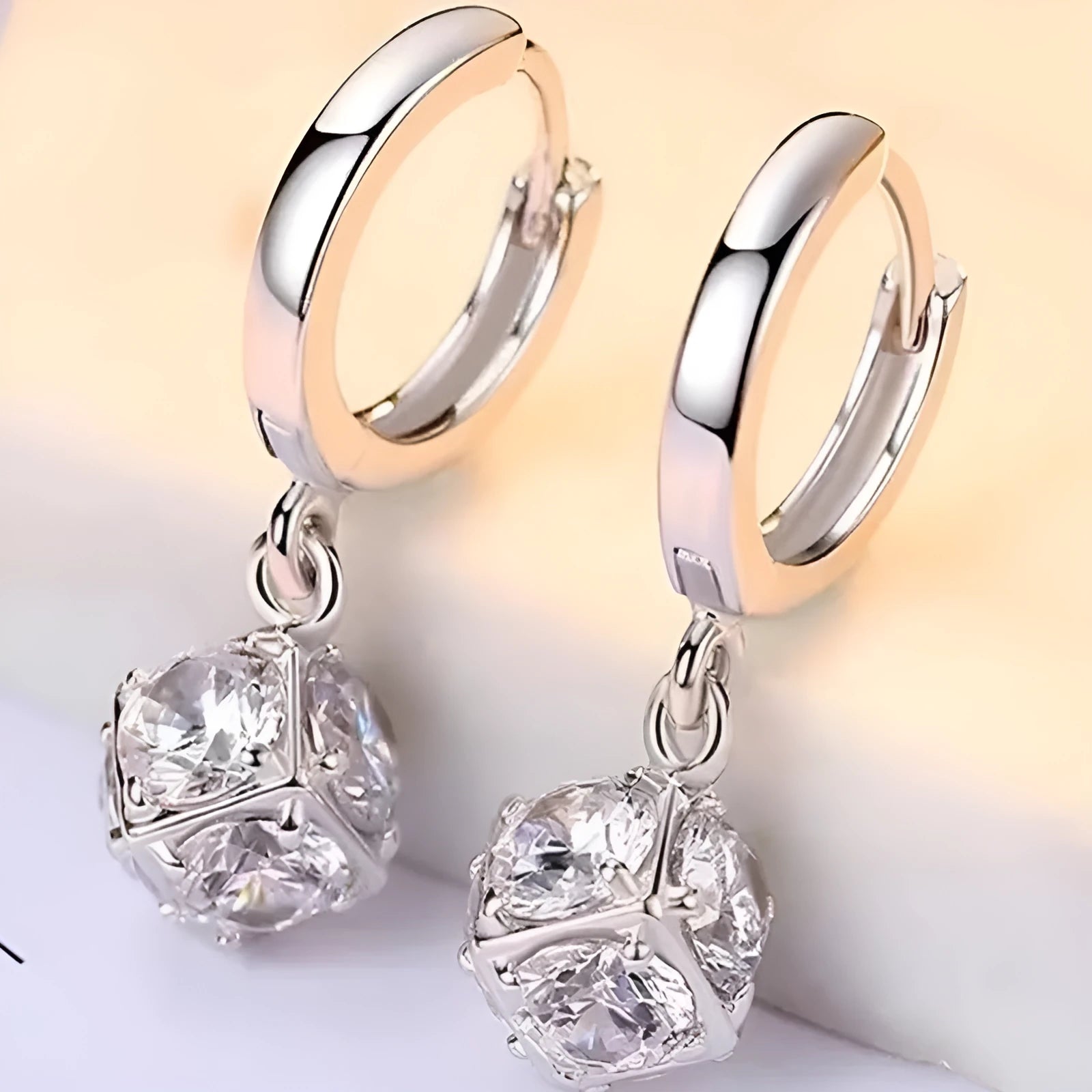 Geometric rose design copper earrings with zircon stones in an electroplated colour finish.