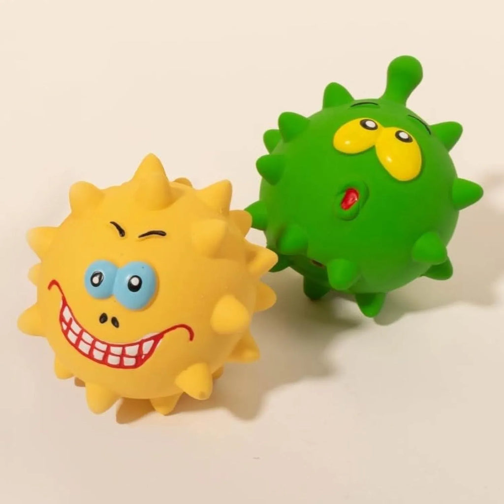 Set of four colourful natural latex squeaky dog balls with cute faces, shown with a dog.