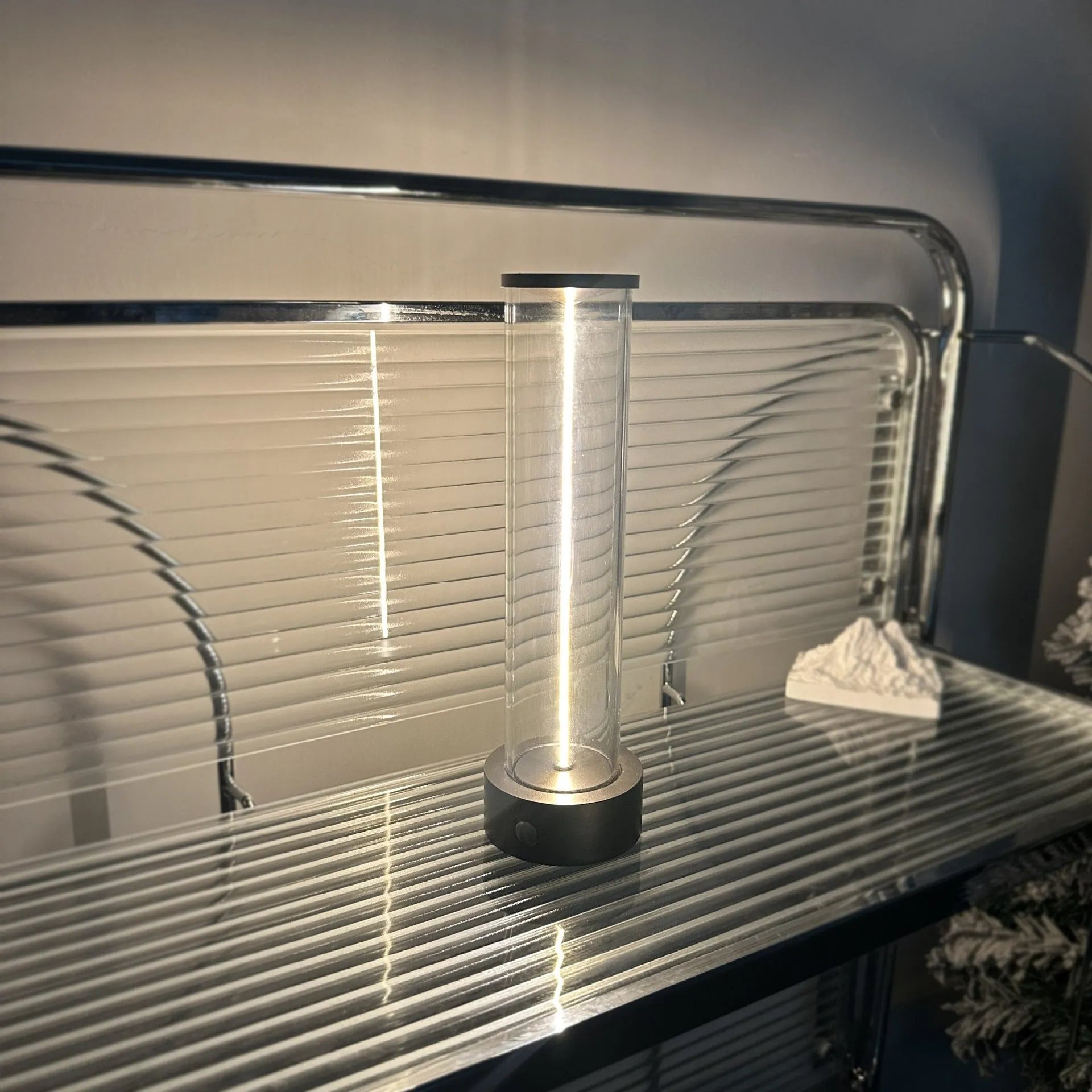 Modern rectangular LED light strip with frosted glass panel, shown with USB cable for charging.