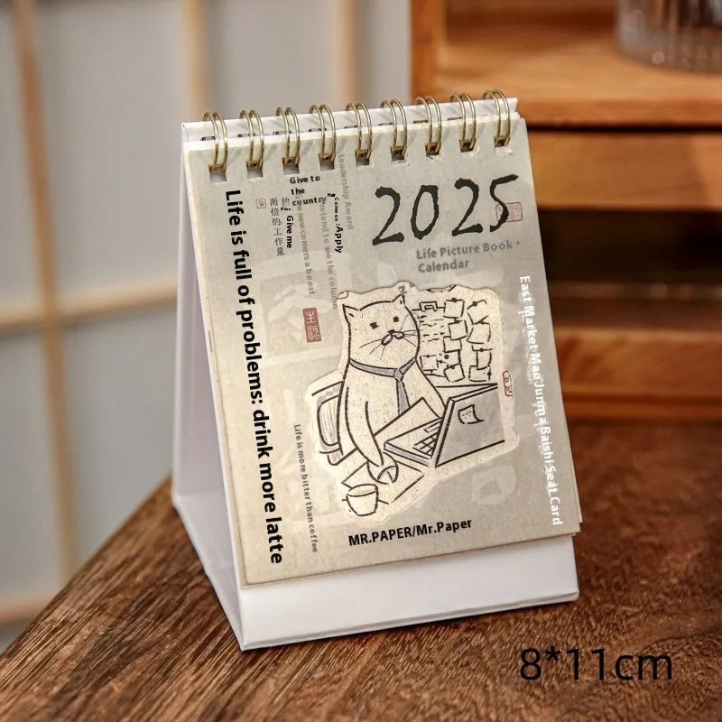 Mini 2025 desk calendar showing multiple design options including Coffee Time and Life Is Not Easy themes