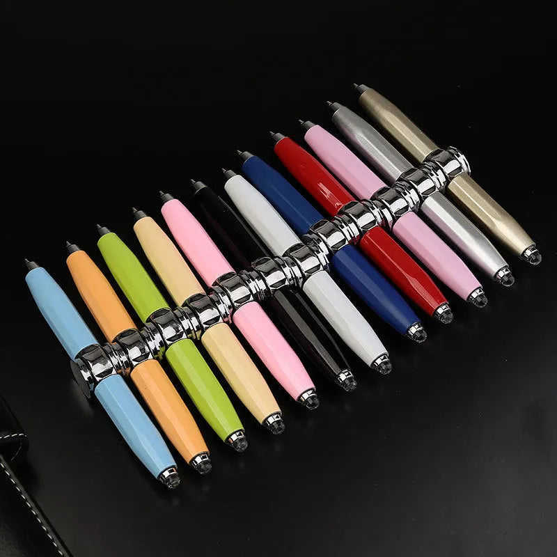 Metal ballpoint pen with integrated LED gyro spinner showing colour-changing lights during spinning