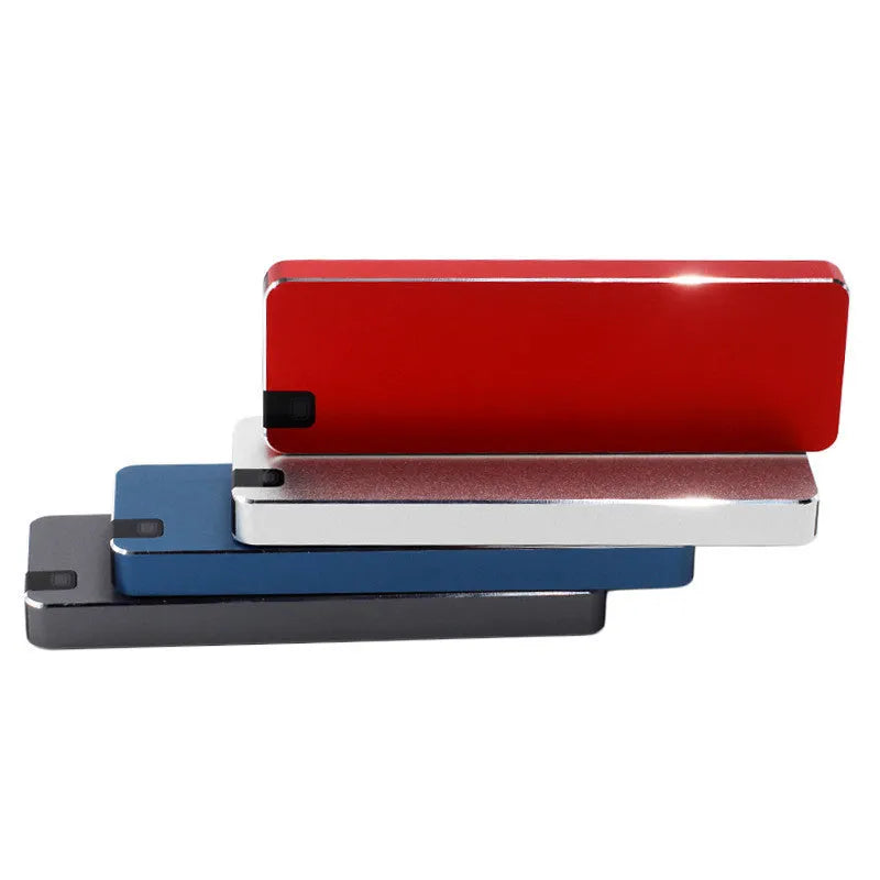White metal-shell mobile solid state drive with USB 3.1 cable on packaging