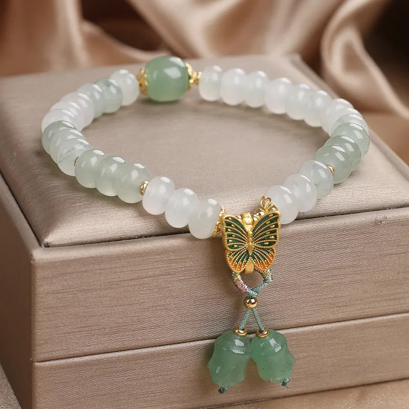 Green Tian Shan Cui abacus beads jade bracelet with butterfly tassel and pearl accents