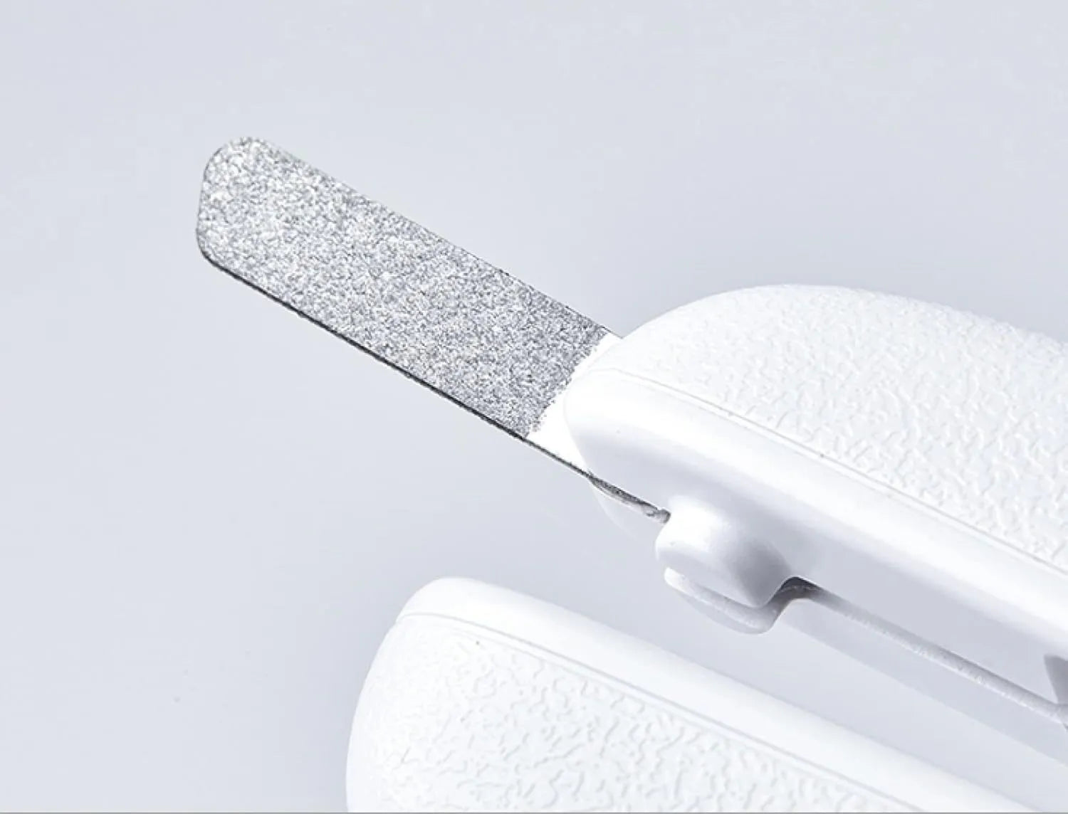 White pet nail clippers with LED light, anti-splash guard, and leather-like handle.